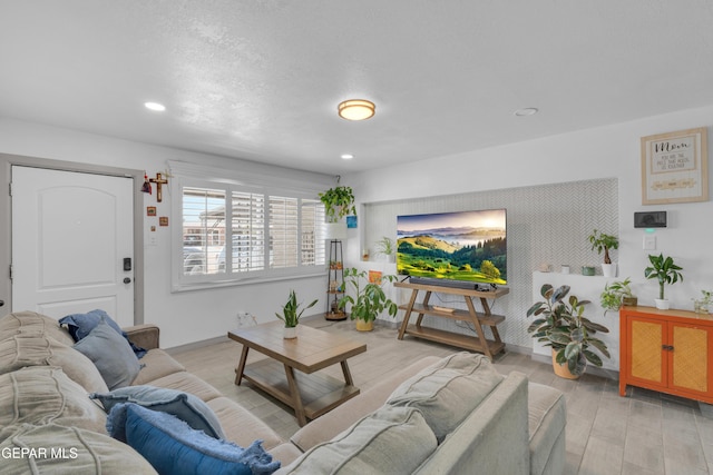 8142 Cook Dr, El Paso, TX 79907 - living room with recessed lighting and light wood finished floors