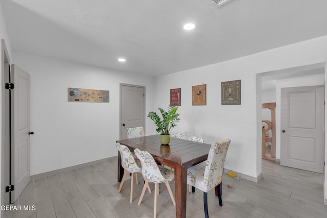 8142 Cook Dr, El Paso, TX 79907 - dining area featuring light wood finished floors and recessed lighting