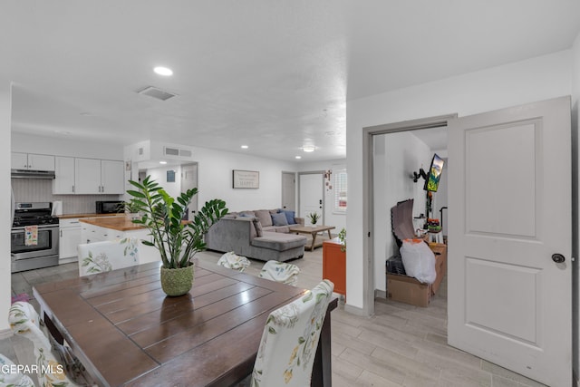 8142 Cook Dr, El Paso, TX 79907 - dining space with wood finish floors and recessed lighting