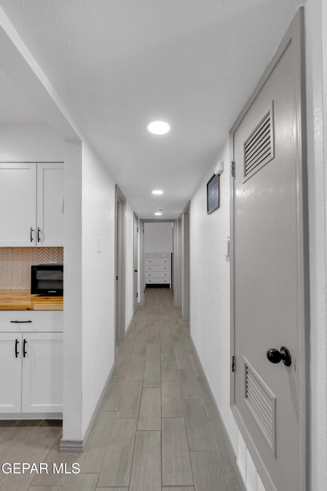 8142 Cook Dr, El Paso, TX 79907 - hall featuring baseboards