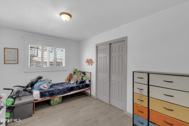 8142 Cook Dr, El Paso, TX 79907 - bedroom featuring light wood finished floors and a closet