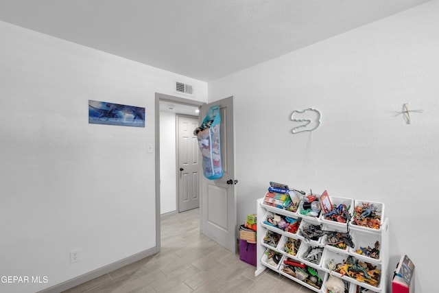 8142 Cook Dr, El Paso, TX 79907 - playroom with light wood finished floors and baseboards