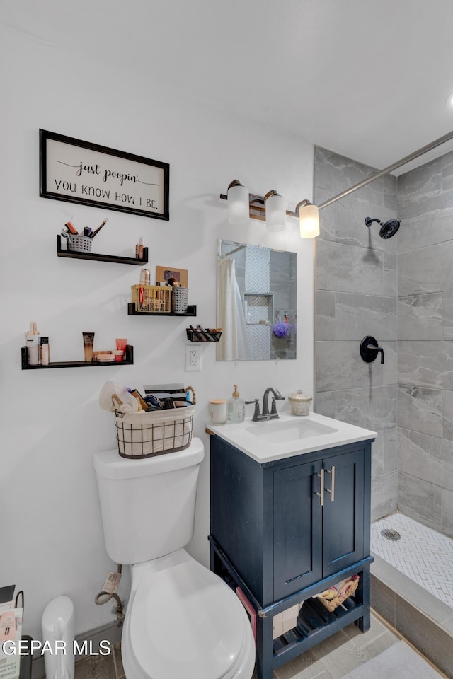8142 Cook Dr, El Paso, TX 79907 - bathroom featuring a tile shower and vanity