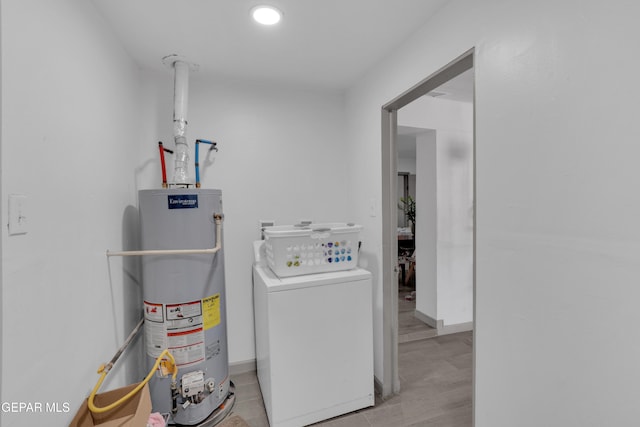 8142 Cook Dr, El Paso, TX 79907 - washroom with gas water heater, washer / clothes dryer, light wood finished floors, and recessed lighting