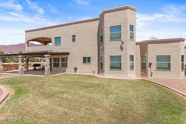 6310 Franklin Crest Dr, El Paso, TX 79912 - back of house featuring stucco siding, a yard, a patio area, and a pergola