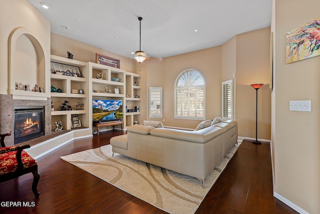 6310 Franklin Crest Dr, El Paso, TX 79912 - living room featuring dark wood-style flooring, a tile fireplace, and recessed lighting
