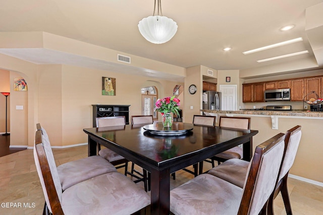 6310 Franklin Crest Dr, El Paso, TX 79912 - dining room with arched walkways and baseboards