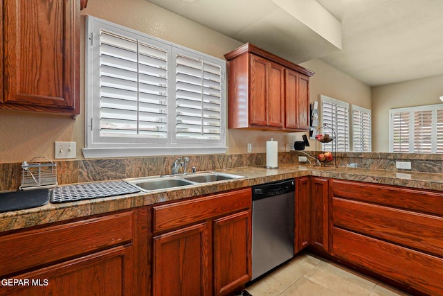6310 Franklin Crest Dr, El Paso, TX 79912 - kitchen with stainless steel dishwasher, tile countertops, healthy amount of natural light, and light tile patterned floors