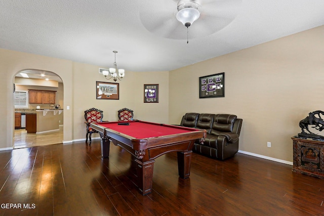 6310 Franklin Crest Dr, El Paso, TX 79912 - recreation room with wood finished floors, arched walkways, billiards, ceiling fan, and a chandelier