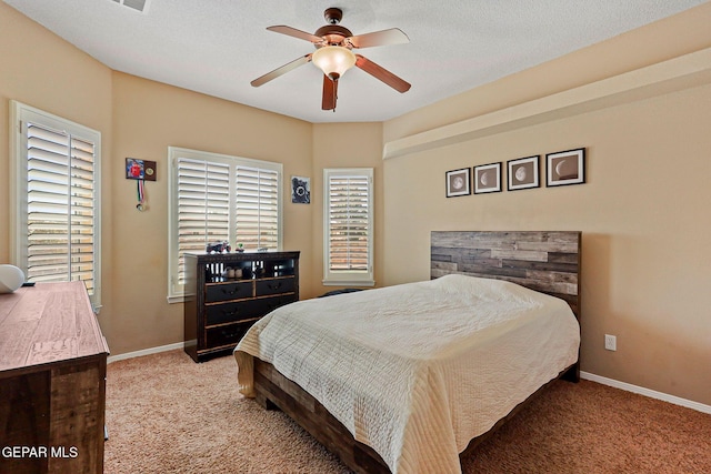 6310 Franklin Crest Dr, El Paso, TX 79912 - carpeted bedroom with baseboards and ceiling fan
