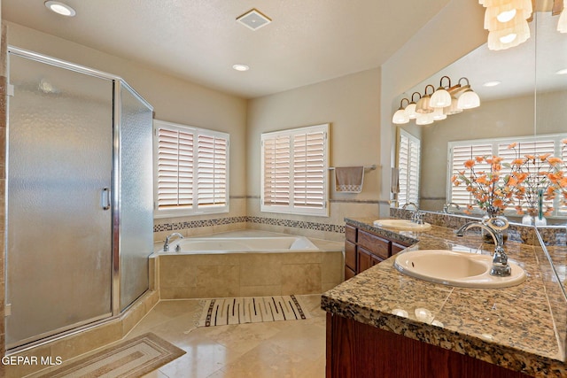 6310 Franklin Crest Dr, El Paso, TX 79912 - full bath featuring a bath, a shower stall, and double vanity
