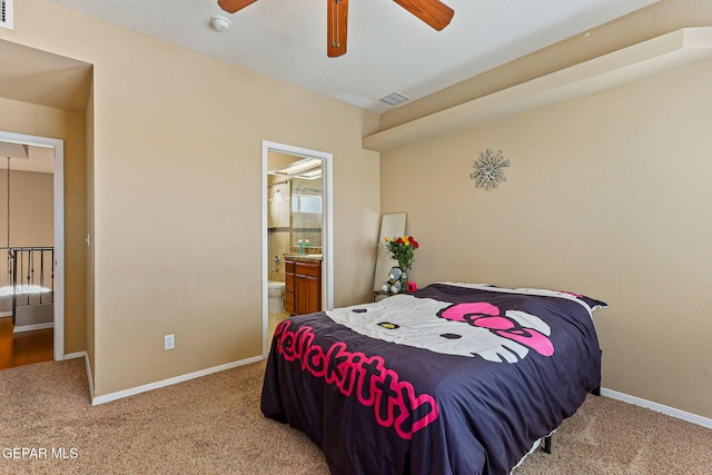 6310 Franklin Crest Dr, El Paso, TX 79912 - carpeted bedroom with ensuite bath and a ceiling fan