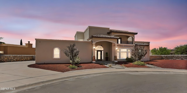 6310 Franklin Crest Dr, El Paso, TX 79912 - mediterranean / spanish house featuring stucco siding and a balcony