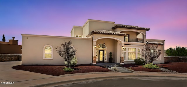 6310 Franklin Crest Dr, El Paso, TX 79912 - mediterranean / spanish house with a balcony and stucco siding
