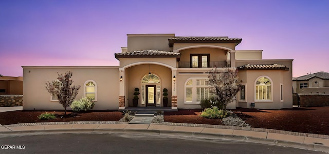 6310 Franklin Crest Dr, El Paso, TX 79912 - mediterranean / spanish-style home featuring a balcony, stucco siding, french doors, a porch, and a tile roof