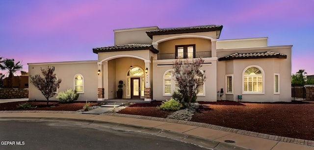 6310 Franklin Crest Dr, El Paso, TX 79912 - mediterranean / spanish-style home with a balcony, french doors, and stucco siding