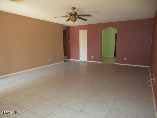 3204 Olive Point Dr, El Paso, TX 79938 - unfurnished room with arched walkways, a ceiling fan, and light tile patterned floors