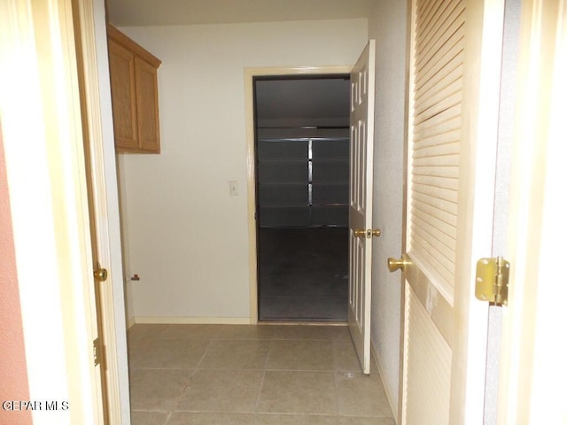 3204 Olive Point Dr, El Paso, TX 79938 - corridor with light tile patterned floors and baseboards