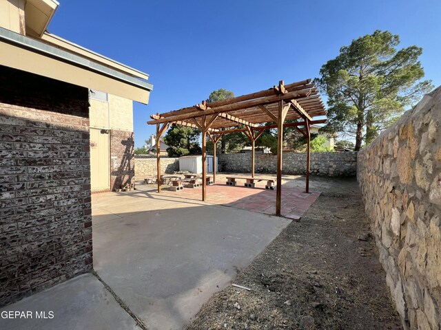 11713 Francis Scobee Dr, El Paso, TX 79936 - fenced backyard featuring a storage shed, a patio area, and a pergola