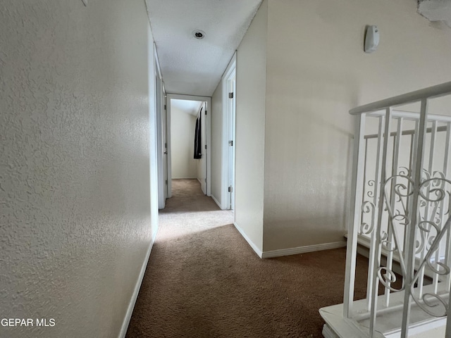 11713 Francis Scobee Dr, El Paso, TX 79936 - corridor with carpet floors and baseboards