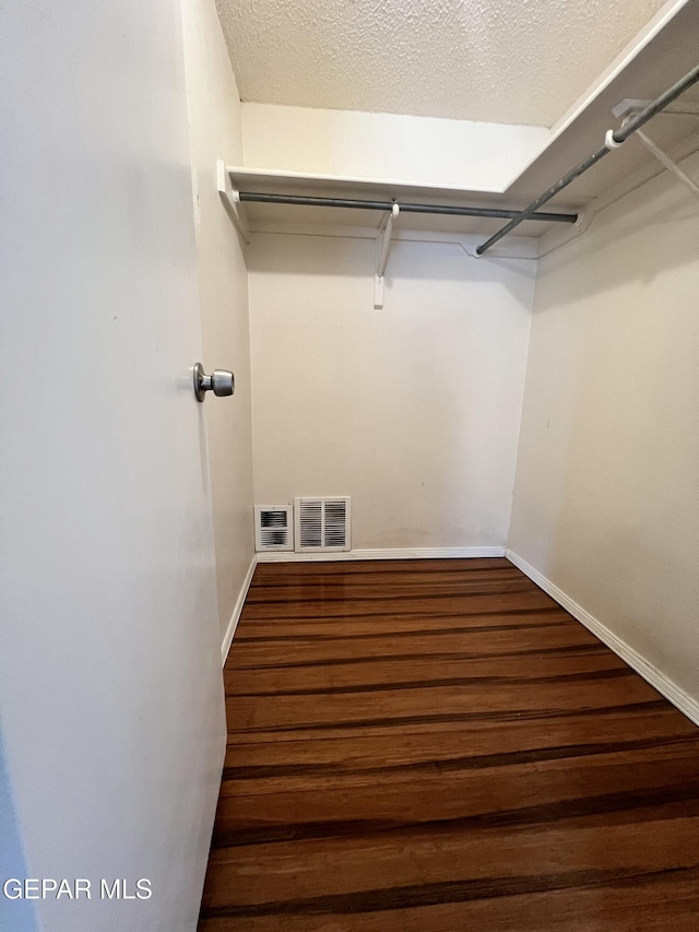11713 Francis Scobee Dr, El Paso, TX 79936 - spacious closet featuring wood finished floors