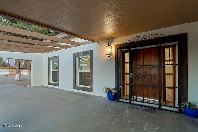 796 Fescue Dr, Canutillo, TX 79835 - entrance to property featuring stucco siding and a patio area