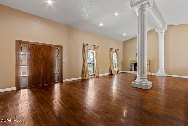 796 Fescue Dr, Canutillo, TX 79835 - unfurnished living room featuring ornate columns, vaulted ceiling, hardwood / wood-style flooring, and recessed lighting