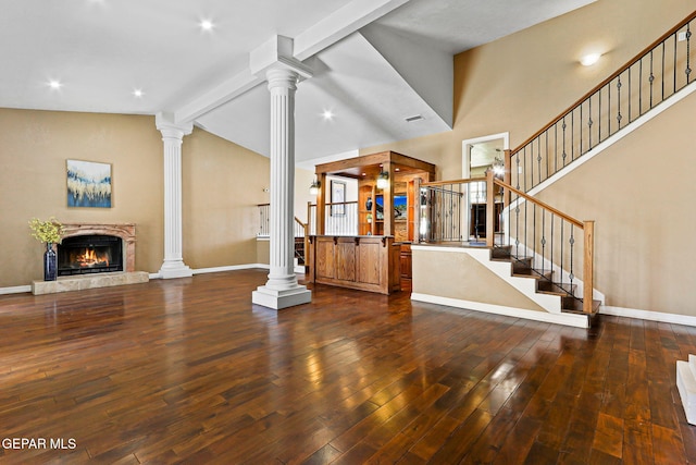 796 Fescue Dr, Canutillo, TX 79835 - entrance foyer featuring decorative columns, dark wood-type flooring, a high end fireplace, and stairway