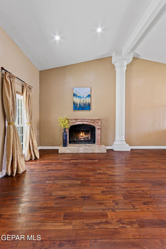 796 Fescue Dr, Canutillo, TX 79835 - unfurnished living room with ornate columns, lofted ceiling, wood finished floors, a fireplace, and recessed lighting