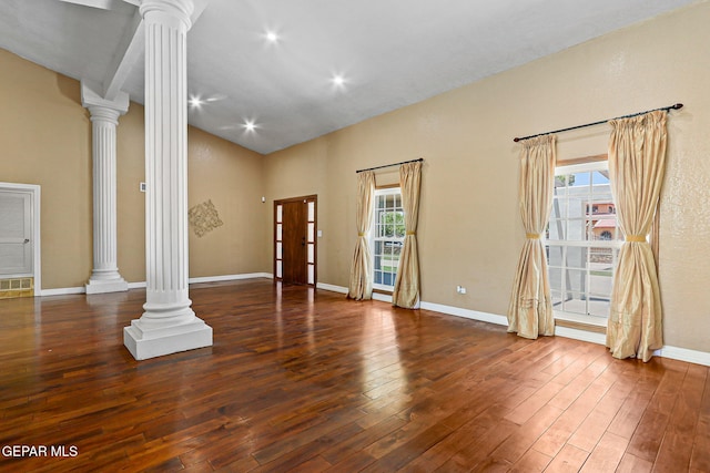 796 Fescue Dr, Canutillo, TX 79835 - unfurnished living room with decorative columns, plenty of natural light, wood-type flooring, and high vaulted ceiling