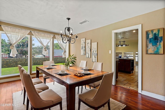 796 Fescue Dr, Canutillo, TX 79835 - dining space featuring a chandelier and dark wood-type flooring