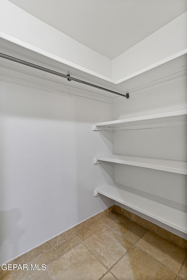 796 Fescue Dr, Canutillo, TX 79835 - spacious closet with stone finish floors