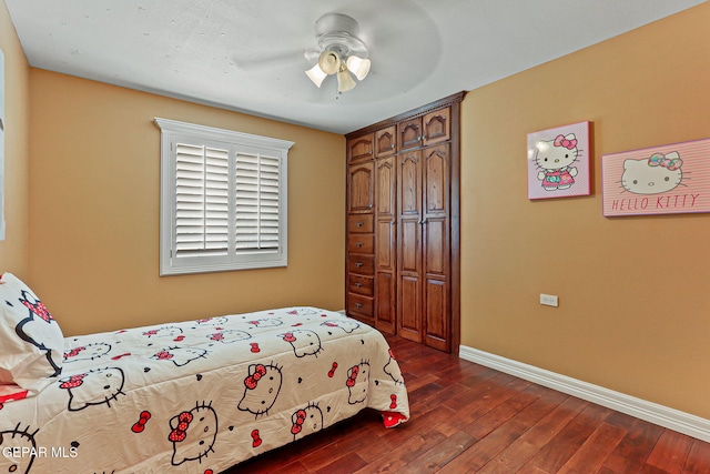 796 Fescue Dr, Canutillo, TX 79835 - bedroom with dark wood-type flooring, a closet, and a ceiling fan