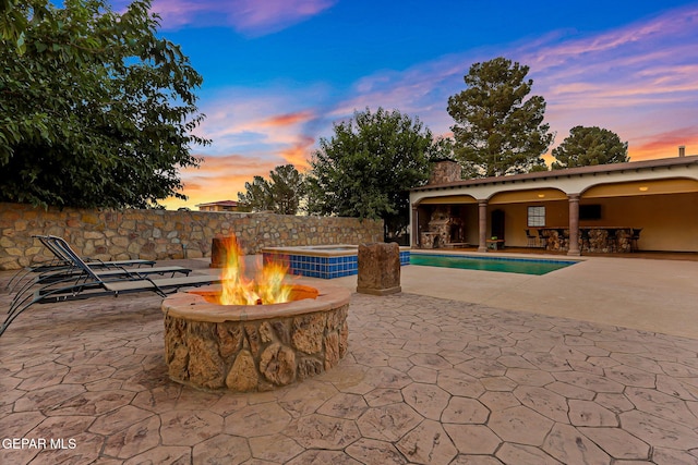 796 Fescue Dr, Canutillo, TX 79835 - view of patio / terrace with a fire pit, a bar, and a pool with connected hot tub