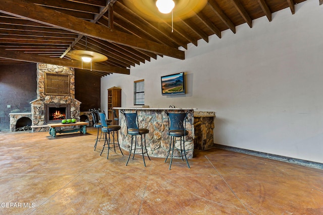 796 Fescue Dr, Canutillo, TX 79835 - bar featuring a stone fireplace and concrete floors