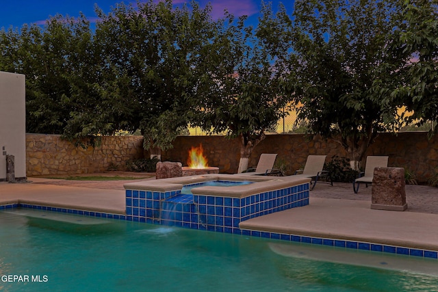 796 Fescue Dr, Canutillo, TX 79835 - pool at dusk with a patio and a pool with connected hot tub