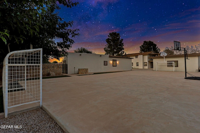 796 Fescue Dr, Canutillo, TX 79835 - rear view of house featuring stucco siding, a gate, and an area for sports
