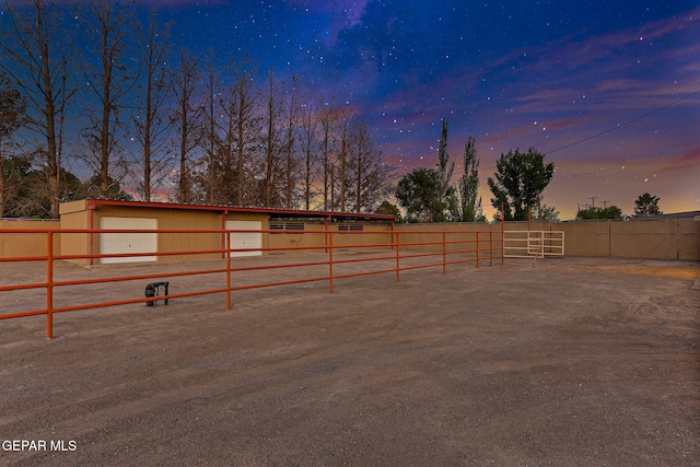 796 Fescue Dr, Canutillo, TX 79835 - yard at dusk with an exterior structure and an outbuilding
