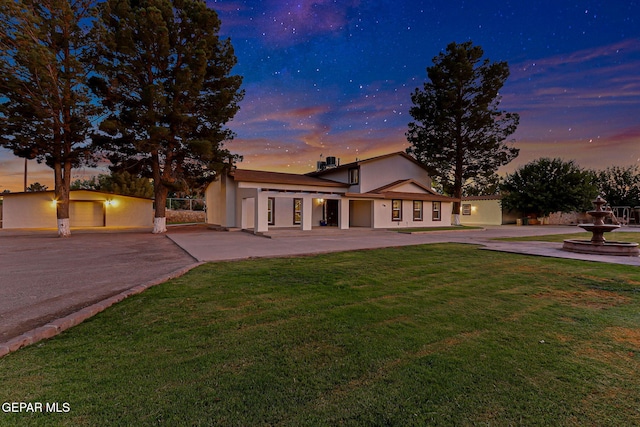 796 Fescue Dr, Canutillo, TX 79835 - view of front of house with driveway, a yard, stucco siding, and a patio area