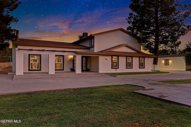 796 Fescue Dr, Canutillo, TX 79835 - view of front facade featuring a front yard, stucco siding, and decorative driveway