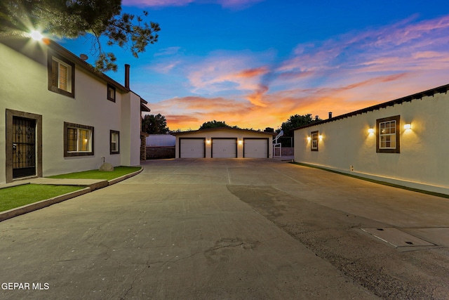 796 Fescue Dr, Canutillo, TX 79835 - view of property exterior with a garage, stucco siding, and an outdoor structure