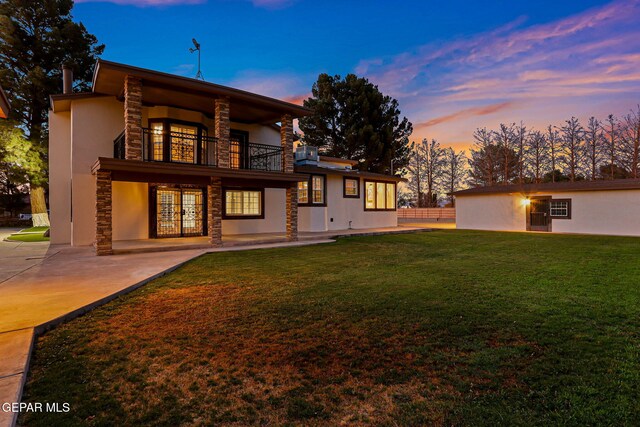 796 Fescue Dr, Canutillo, TX 79835 - rear view of house with a balcony, stone siding, a yard, french doors, and a patio area
