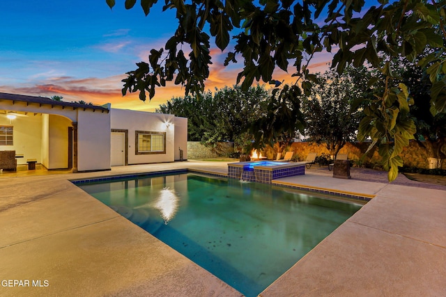 796 Fescue Dr, Canutillo, TX 79835 - pool at dusk with a patio and a pool with connected hot tub