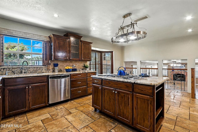 796 Fescue Dr, Canutillo, TX 79835 - kitchen with appliances with stainless steel finishes, stone tile floors, recessed lighting, and plenty of natural light