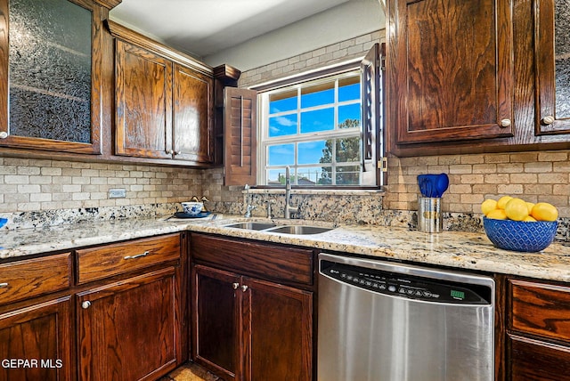 796 Fescue Dr, Canutillo, TX 79835 - kitchen featuring stainless steel dishwasher, backsplash, light stone counters, and glass insert cabinets