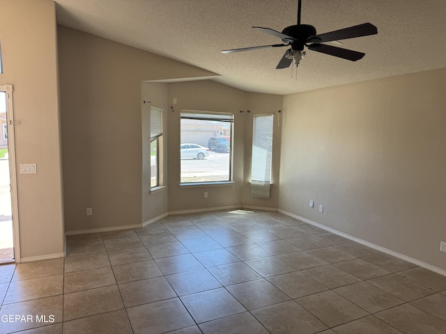 14325 Woods Point Ave, El Paso, TX 79938 - tiled empty room with a textured ceiling and a ceiling fan