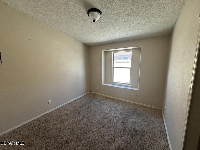 14325 Woods Point Ave, El Paso, TX 79938 - carpeted spare room featuring a textured ceiling and baseboards