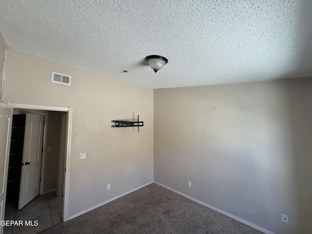 14325 Woods Point Ave, El Paso, TX 79938 - carpeted spare room featuring a textured ceiling and baseboards