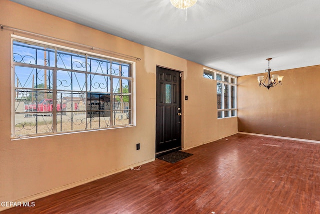 541 Val Verde St, El Paso, TX 79905 - foyer entrance featuring a chandelier and wood finished floors
