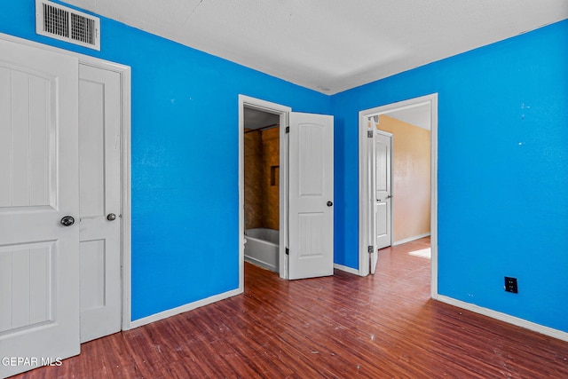 541 Val Verde St, El Paso, TX 79905 - unfurnished bedroom with wood finished floors and baseboards